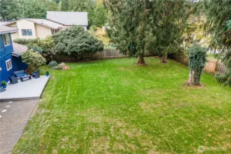 There's plenty of room to construct a garden shed in this generous backyard.