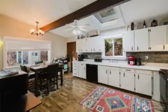 The skylights allow for natural light giving this home added ambience. The large window from the eating area offers viewing of outdoor nature. You won't be disappointed.