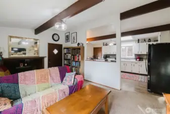 The livingroom flows seamlessly to the eat-in kitchen with tons of cabinets!
