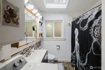 The laundry shares space with the full bathroom. All appliances stay with this home.