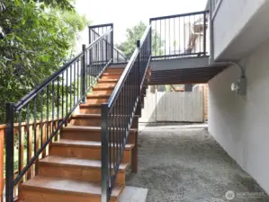 Deck with stairs leading to the back yard.