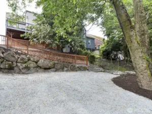 View from the back of the yard looking up to the house. Could be used for extra parking or DADU.
