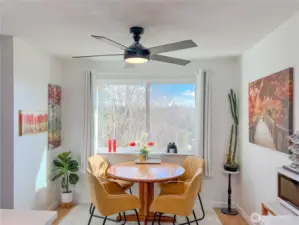 Sun filled dining room with custom ceiling fan