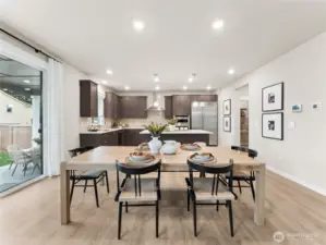 Large Great room can separate eating area. Photo is representational. Actual home is under construction and finishes and colors will vary. See site agent for details.
