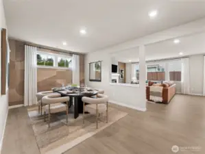 Over-looking at the dining room and family room.  Photo is representational. Actual home is under construction and finishes and colors will vary. See site agent for details.