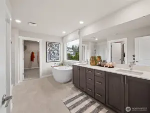 5-piece primary bath with attached walk-in closet. Photo is representational. Actual home is under construction and finishes and colors will vary. See site agent for details.