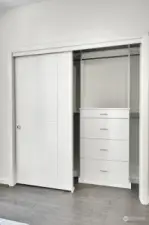 Large closet with custom built ins