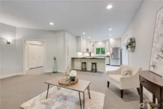 Roomy living area adjoins kitchen.  One bedroom on each side of the utility area doors you see to the left. 42" entry door and 36" interior for easy wheelchair access.