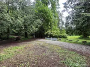 Area around outbuilding and below house