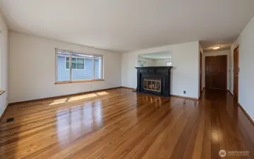 VIRTUAL RENDERING. Hardwood floors on the main floor of the home.