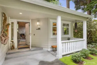 Cozy covered front porch welcomes you inside.