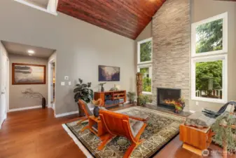Warm-toned wide-plank engineered wood floors anchor the space with beauty and durability.