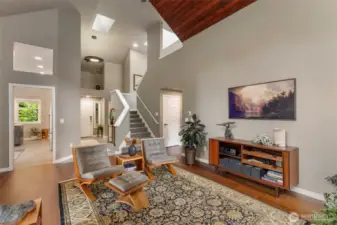 Thoughtful, creative design is center stage in this home. Freshly painted throughout with a serene color pallette making it cozy all year around. The doorway opens into the kitchen and stairs lead to the loft.