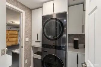 This handy laundry room looks good, too! There is room for everything, and it provides a mud room area adjacent to the garage.