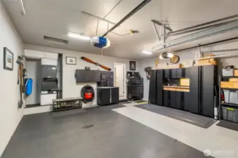 OK, this is a five-star garage! Fully insulated and finished, it features vinyl floor covering and a wall of Husky storage cabinets which stay with the home. A handy new-age sink is along the back wall.