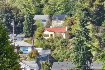 Tucked away up on a hill sits a pretty home with a warm and inviting vibe!