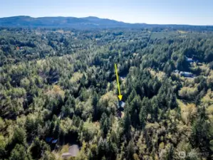 Aerial view of Seabeck. Arrow pointing to the property.