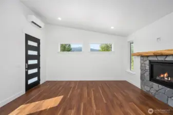 Bright living room with Gaia Luxury Vinyl Plank flooring throughout home.