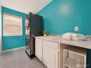 Laundry room with utility sink, upstairs