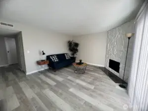 Living room w/ wood-burning FP