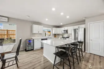 Open Concept Kitchen / Dining with breakfast bar island and