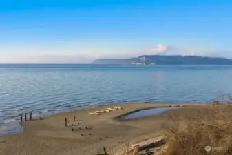 A serene beachside view offers a peaceful escape just moments away from the home.