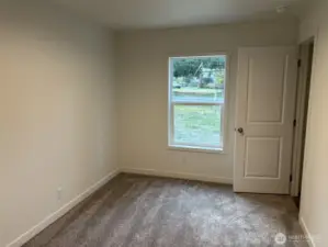 Guest Bedroom with door to closet.