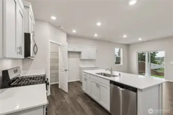 Thoughtfully designed kitchen with walk in pantry.