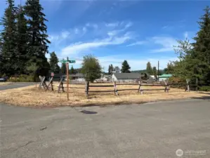 it's located at the end of the block with paved roads on 3 sides.