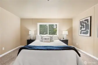 Primary bedroom is situated on one side of the home with additional beds on the other!