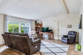 Bright living space filled with natural light, ideal for reading or relaxing.