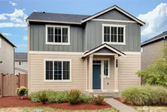 Outside view of home, refreshed landscaping front and back.