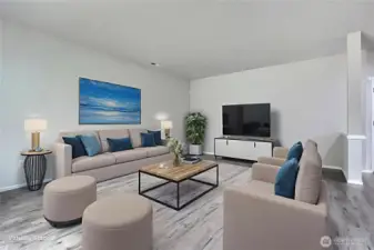 As you enter, on your left you will find a generously-sized living room, and I love the flooring throughout this level. ***Virtually Staged***