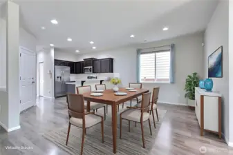 As you enter, down the hall to the right is your dining area. The open concept design really works for this home. ***Virtually Staged***