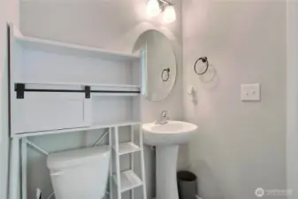 First floor powder room, down the hall from the kitchen by the back door.