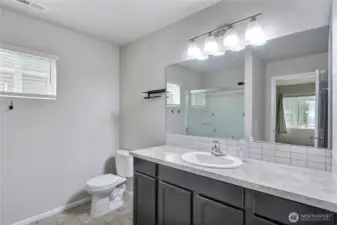 Primary bedroom ensuite bathroom.