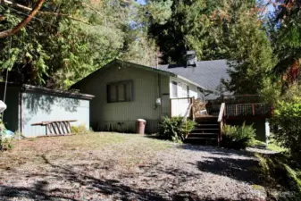 Storage shed and existing cabin located on the northeast edge of the lot.