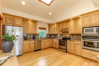 Bright Large kitchen with 2 ovens, new refrigerator and skylight.