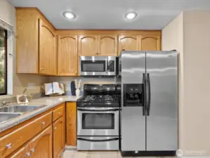 The appliances include this gas range and built-in microwave.