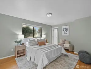 The primary bedroom is luxuriously large and includes double closets.