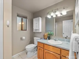 The primary bathroom Features a tiled floor.