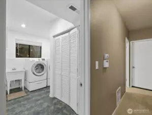 The closet in this space holds the natural gas water heater and furnace. There is an additional storage closet across the hallway.