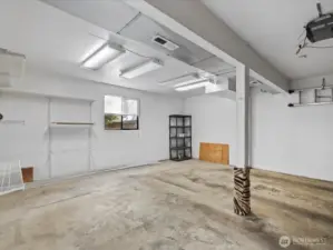 The heated garage has good lighting, storage space, door opener.