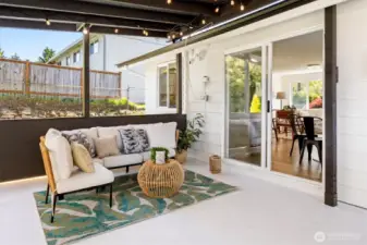 Covered patio extends living space outdoors, ideal for relaxing or entertaining. Image from earlier listing in Sep 2025.