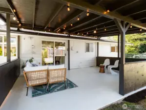 Covered patio extends living space outdoors, ideal for relaxing or entertaining. Image from earlier listing in Sep 2025.