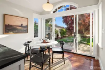 Breakfast nook highlighted by an antique milk glass pendant originally from Portland’s historic Drake Hotel