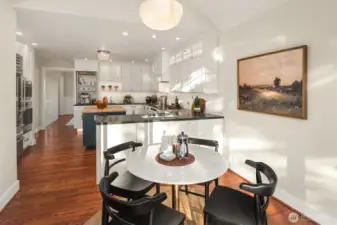 Breakfast nook highlighted by an antique milk glass pendant originally from Portland’s historic Drake Hotel