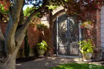 Peace of mind with three beautiful custom wrought iron gates on property.