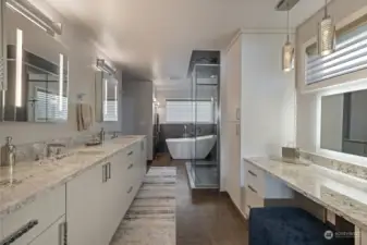Primary bath has that glam factor +...quartz counters with blue sapphire color flecks, laminate cabinets with texture, Robern medicine cabinets, heated contrasting tile floors, soaking tub, oversized shower, Kohler Veil toilet/bidet.