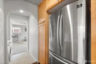 Kitchen fridge and next to that very deep pantry closet.  The utility room is conveniently located off the kitchen.